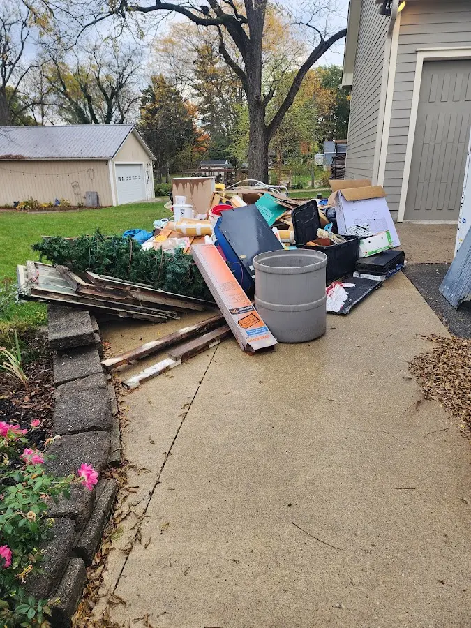 Dumpster being loaded with debris for 3 Yard Dumpster Rental in Willmar